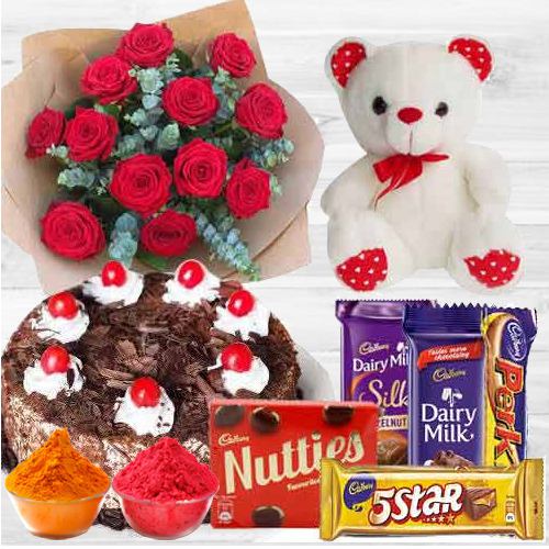 Awesome bouquet of  Roses with a delicious Cake mixed Cadburys Chocolate and lovely Teddy Bear
