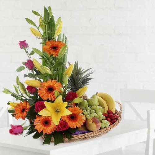 A beautifully arranged fruit and flower basket for dear mom