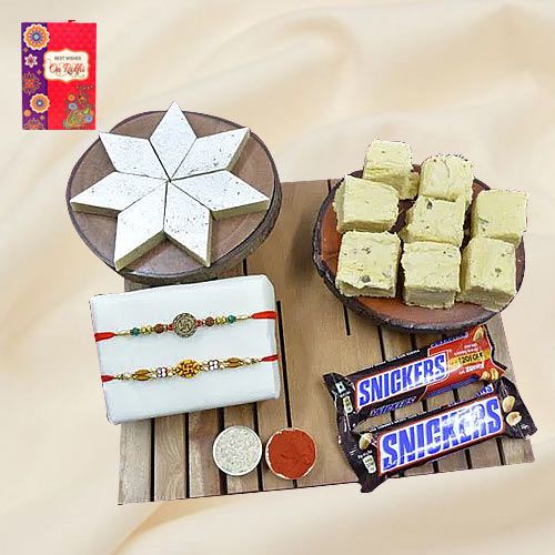Pious Swastik Rakhi with Haldiram Sweets N Imported Snickers