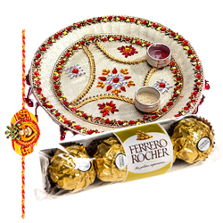 Relishing  Ferreo Rocher Chocolates and a special Pooja Thali with a Free Rakhi Roli Tilak and Chawal