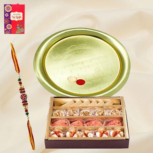 Graceful Gift of Gold Plated Puja Thali and Assorted Sweets from Haldiram with Free Rakhi Roli Tilak and Chawal for your Lovely Siblings